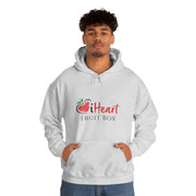 A man wearing a white iHeartFruitBox Unisex Heavy Blend™ Hoodie featuring the word fruit, showcasing his love for organically grown tropical fruits from Printify.