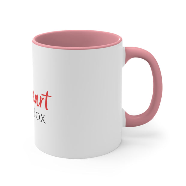 A pink and white iHeartFruitBox Coffee Mug, 11oz with the words Printify on it.