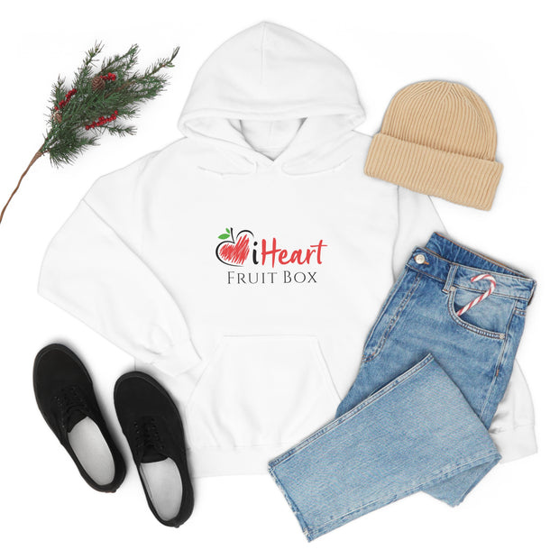 An iHeartFruitBox Unisex Heavy Blend™ Hoodie paired with jeans and boots, perfect for a casual outfit.