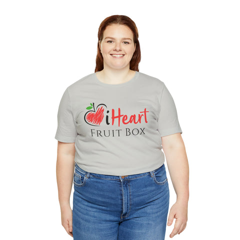 A woman wearing a grey iHeartFruitBox Fitted Unisex T-Shirt by Printify, promoting Tropical Fruit.