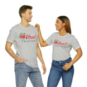 A man and woman in matching iHeartFruitBox Fitted Unisex T-Shirts from Printify.