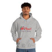 A man wearing an iHeartFruitBox Unisex Heavy Blend™ Hoodie by Printify, representing his love for Tropical Fruit.