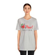 A woman wearing a grey iHeartFruitBox Fitted Unisex T-Shirt by Printify, showcasing her love for the iHeartFruitBox brand.