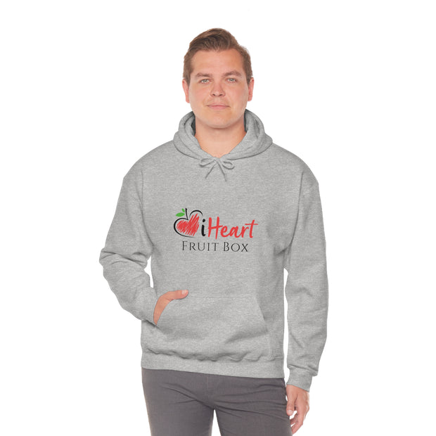 A man wearing a grey Printify hoodie with the word heart on it while holding an iHeartFruitBox Unisex Heavy Blend™ Hoodie.
