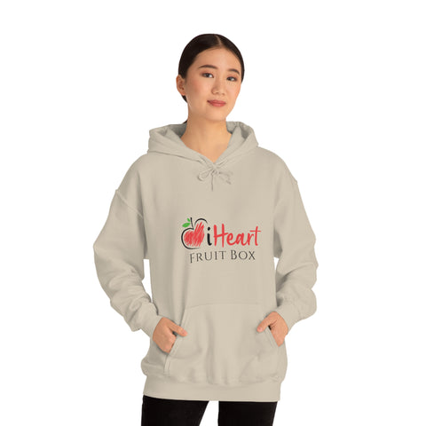 A woman wearing a iHeartFruitBox Unisex Heavy Blend™ Hoodie by Printify, organically grown tropical fruit.
