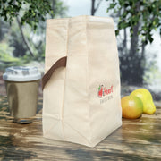 A iHeartFruitBox Branded Canvas Lunch Bag With Strap with tropical fruit and a cup of coffee on a wooden table.