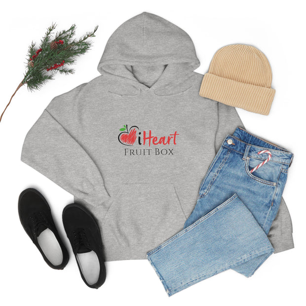 An iHeartFruitBox Unisex Heavy Blend™ Hoodie by Printify paired with jeans and boots for a stylish and comfortable look.