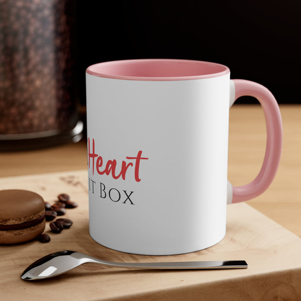An iHeartFruitBox Coffee Mug, 11oz with organically grown coffee beans.