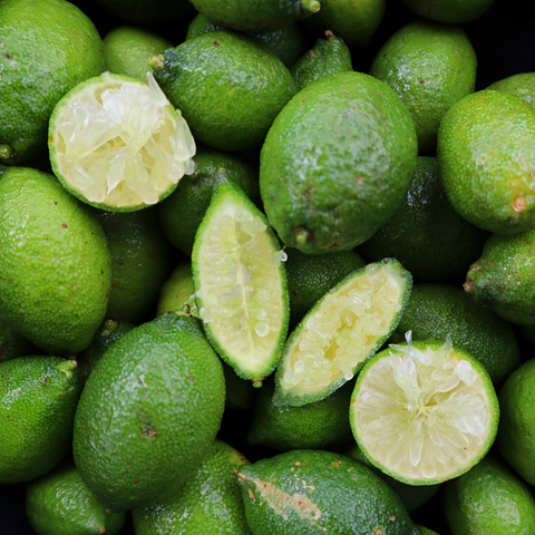 A pile of iHeartFruitBox Finger Limes / Caviar Limes, organically grown and cut in half.
