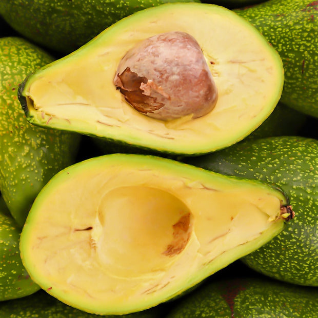 A close up of a bunch of iHeartFruitBox organically grown avocados.