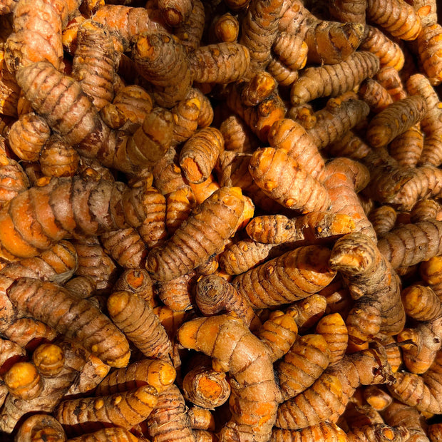 A pile of iHeartFruitBox turmeric worms on a table.